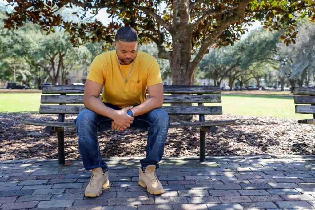 man-sitting-on-bench-in-city-park-01-resize (1)